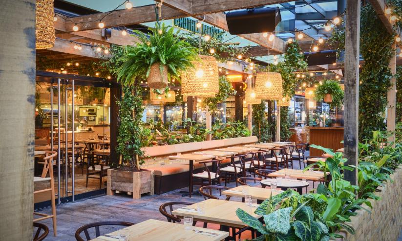 Restaurants surrounded by plants in Spitalfields Market, London