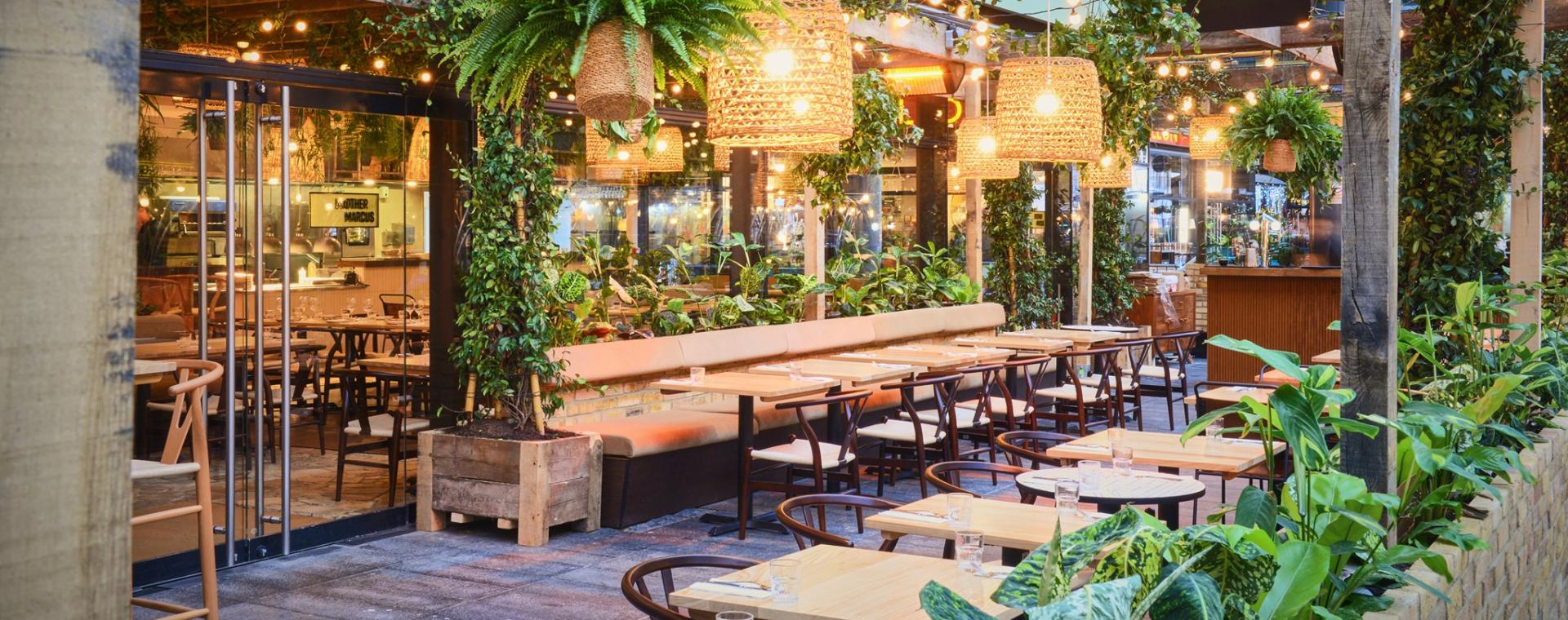 Restaurants surrounded by plants in Spitalfields Market, London