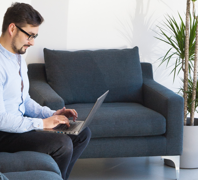 Man working on couch