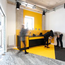 People in a yellow kitchen at Streamline